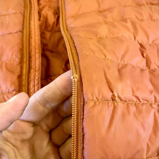 Before - Broken zip and jacket hole.