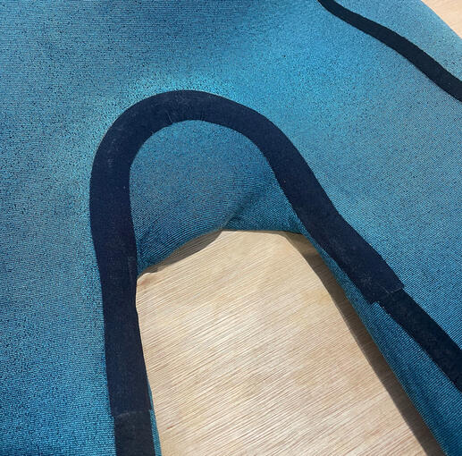 Repaired and seam taped surfing wetsuit.
